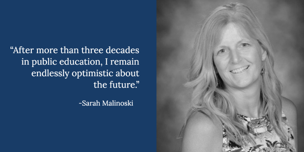 Black-and-white photo of GSP Senior Associate Sarah Malinoski, smiling with long, light hair beside a quote: “After more than three decades in public education, I remain endlessly optimistic about the future.”.